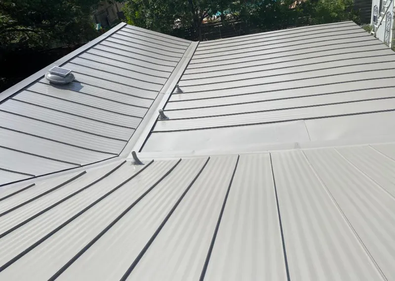 Solar attic fan installed on a metal roof for Roof Ventilation in Hattiesburg